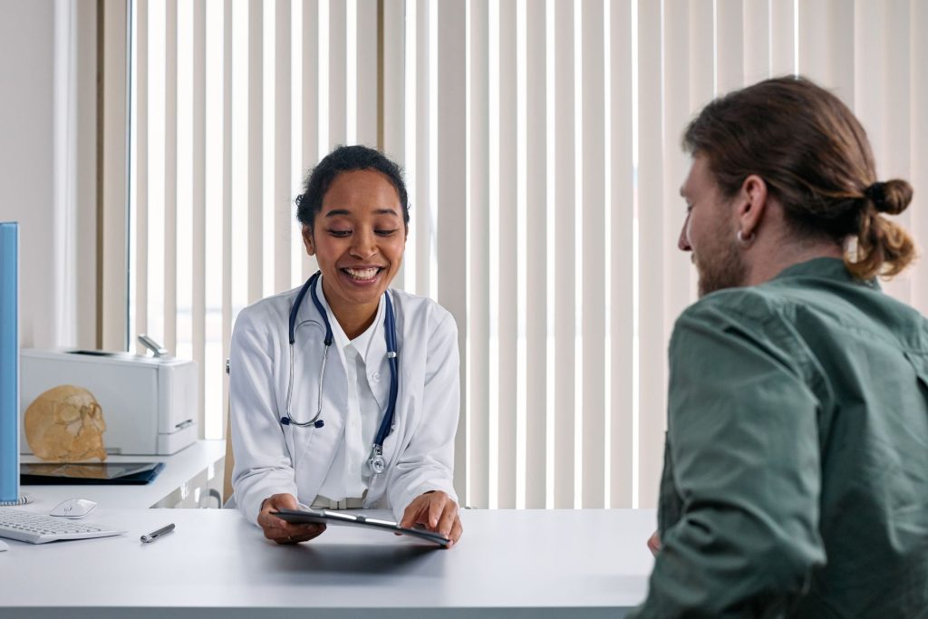 Doctor smiling during a consultation with a patient