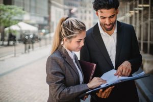 Two colleagues checking documents together